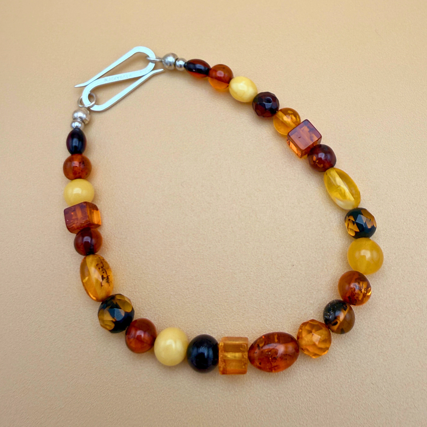 Amber bracelet with handmade silver S-clasp