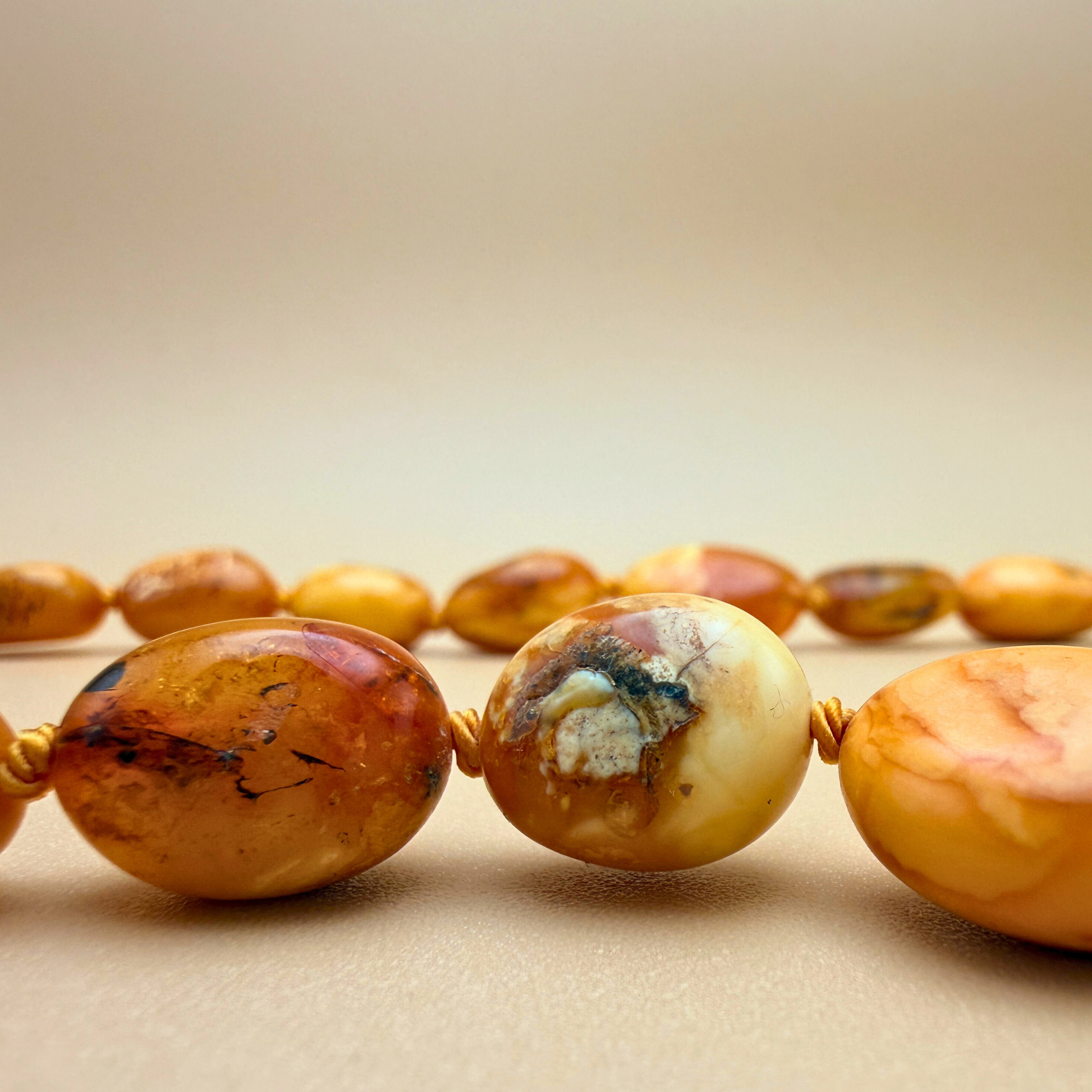 Amber necklace in warm milky tones with natural inclusions. handknotted