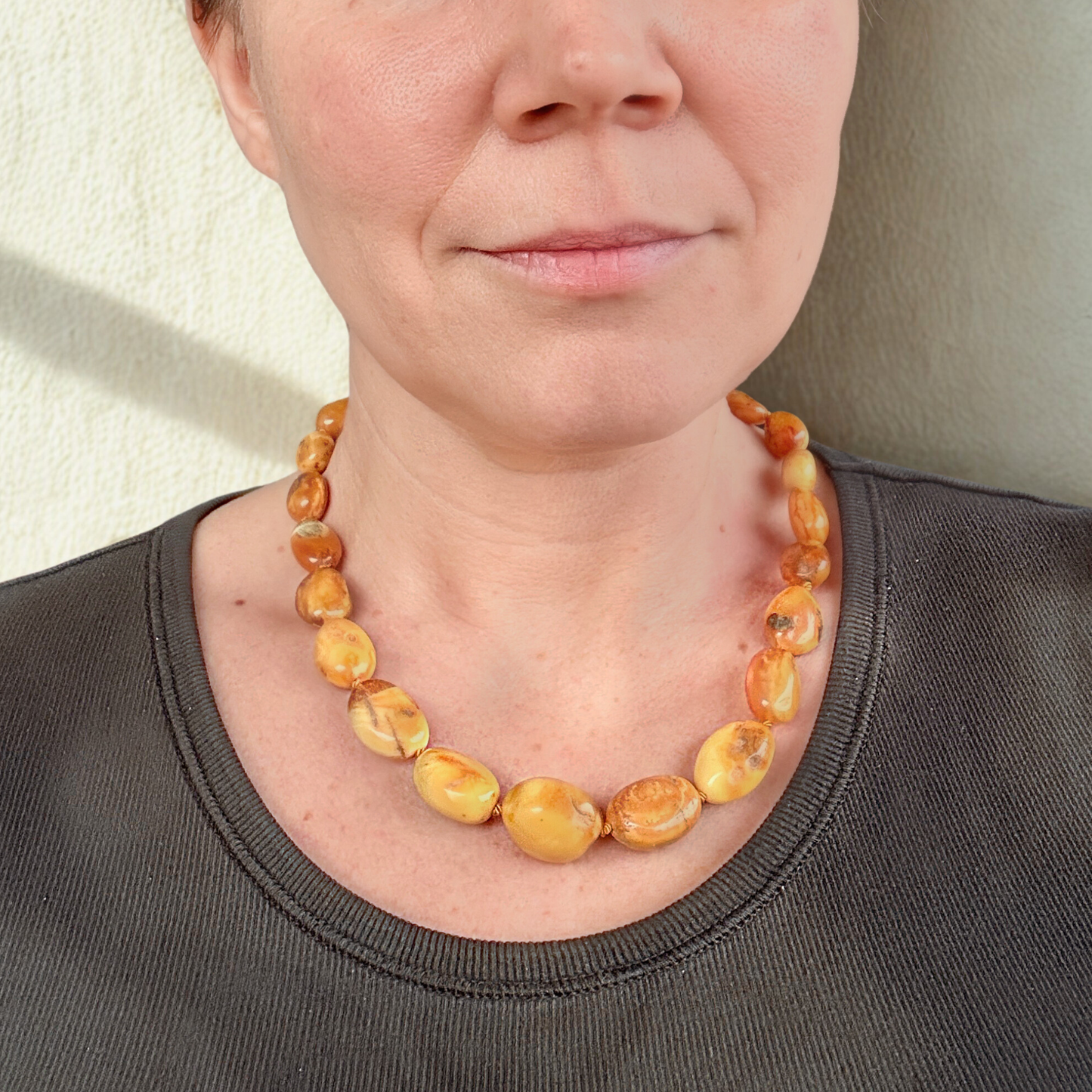 Handknotted amber necklace in milky tones