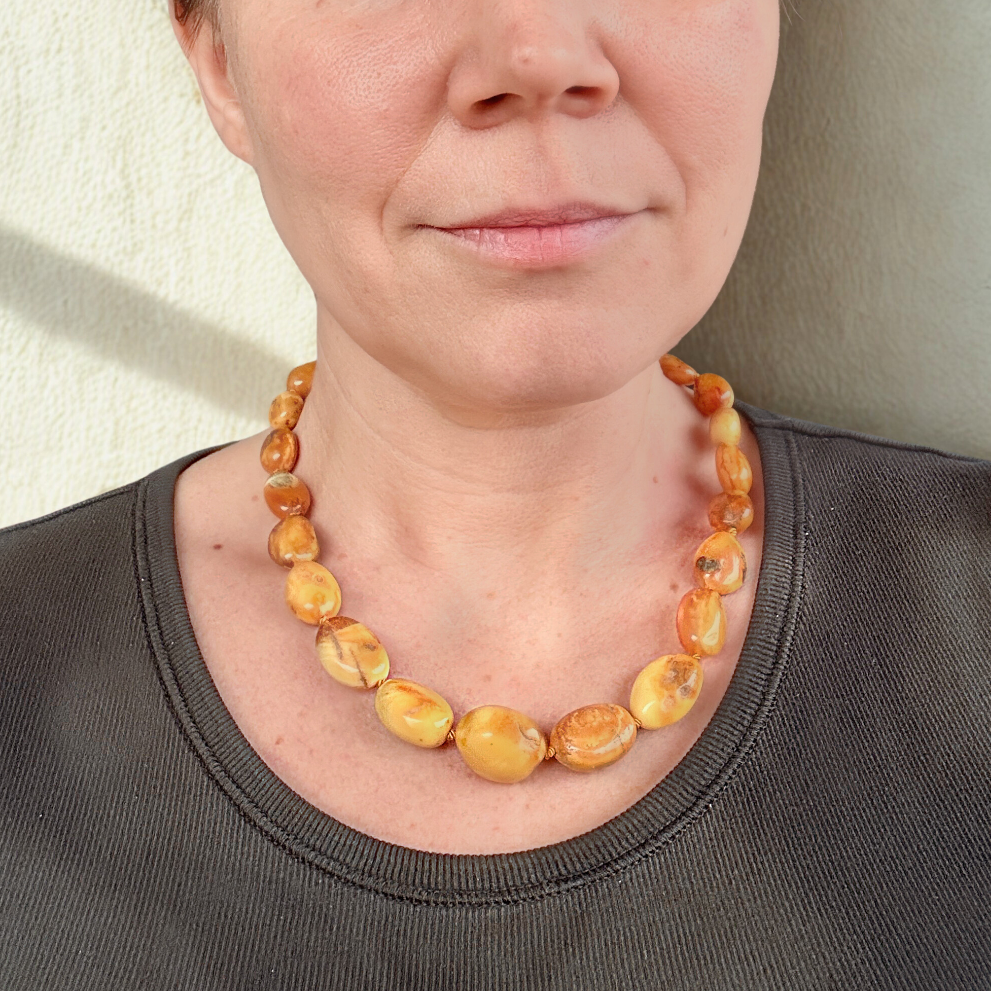 Handknotted amber necklace in milky tones