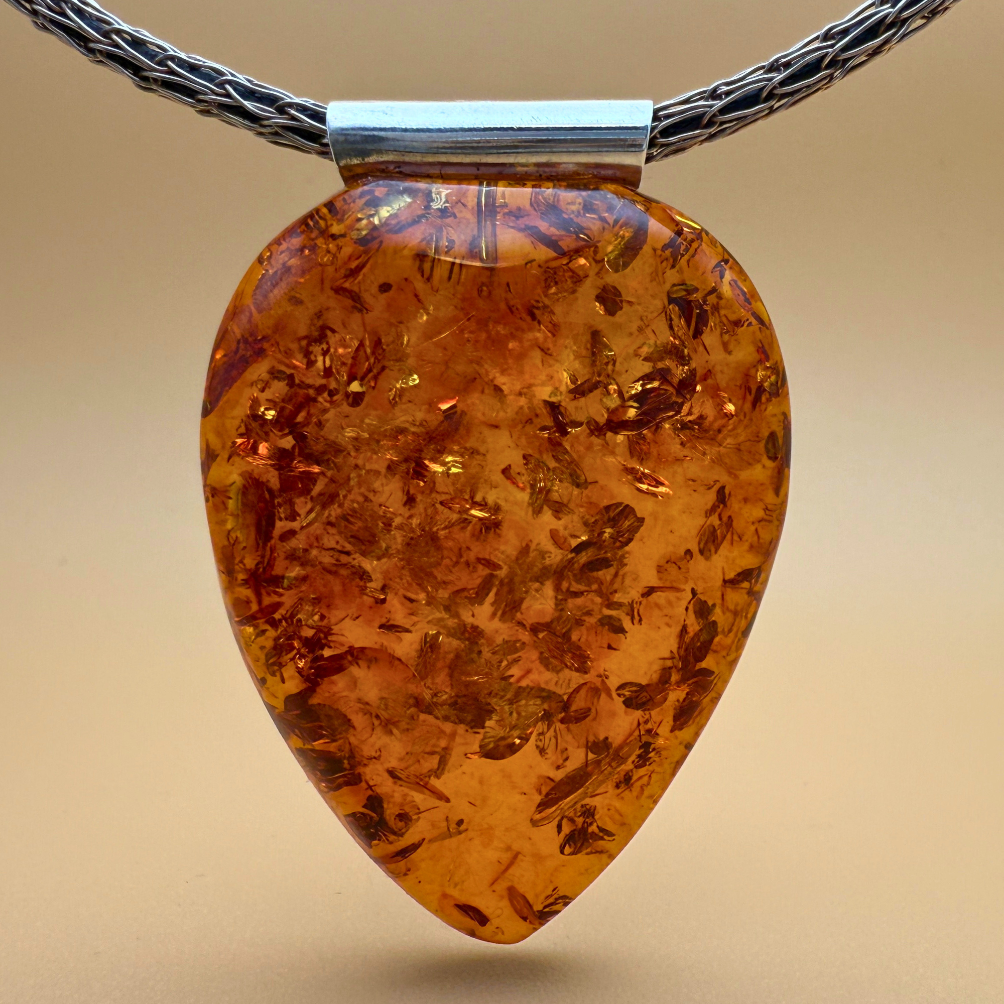 Stunning amber pendant with silver tube bail. One of a kind